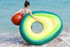 woman holding avocado float in water